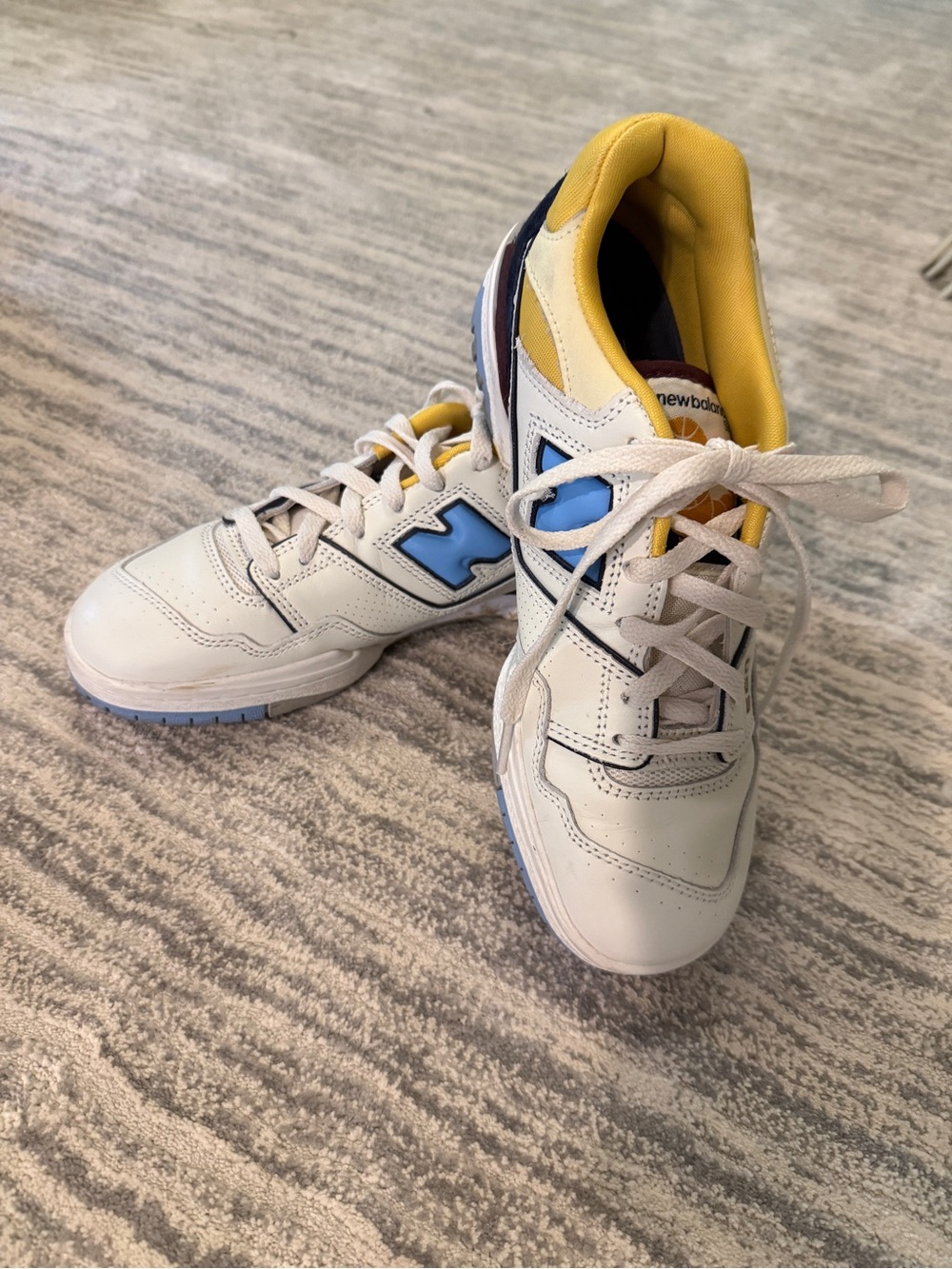 New Balance White Sneakers with Blue Logo and Yellow Lining